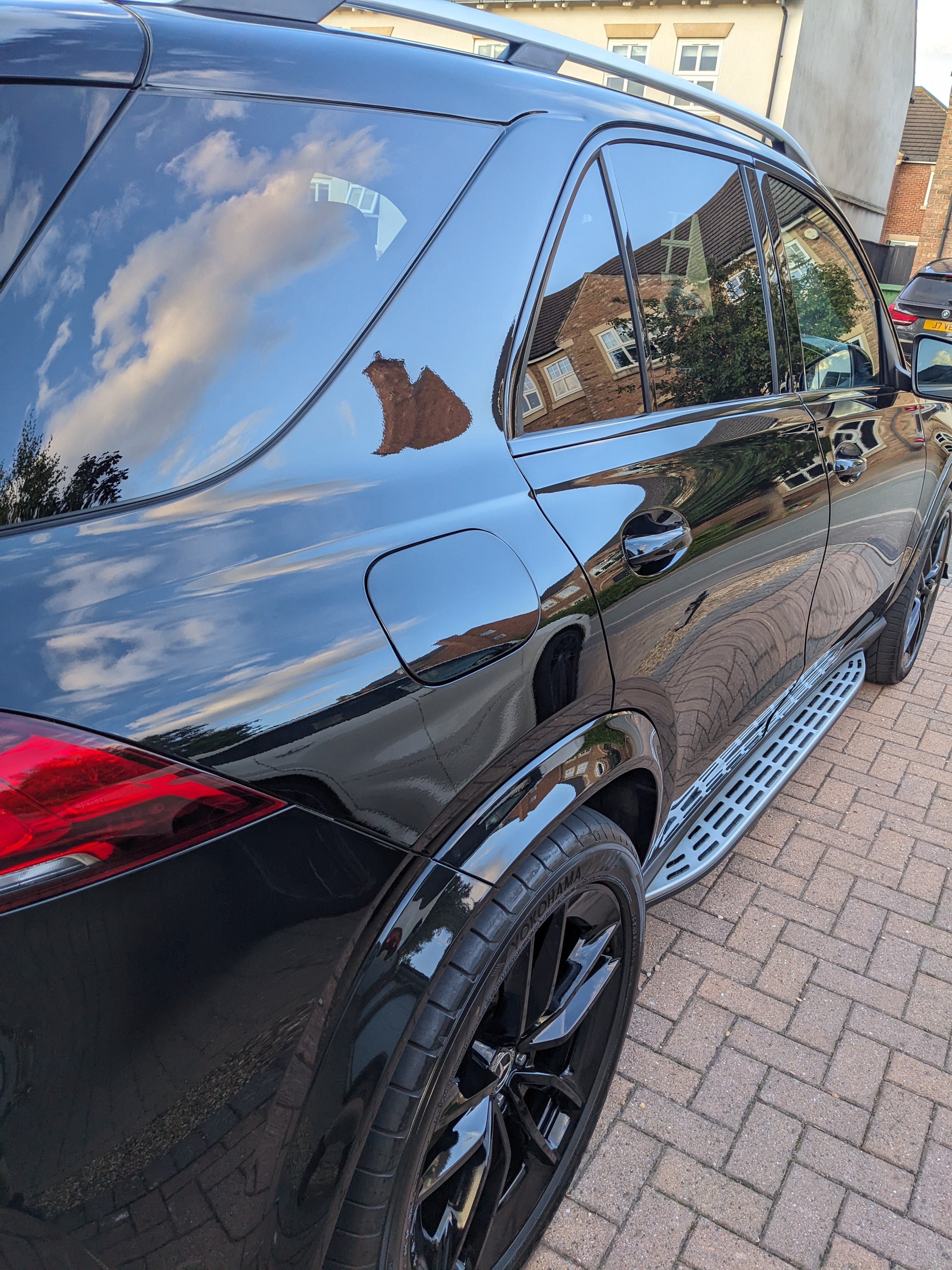 Deep gloss on the rear quarter of a ceramic-coated hatchback